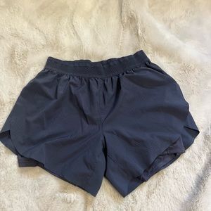 Gray sporty shorts with spandex attached and pocket